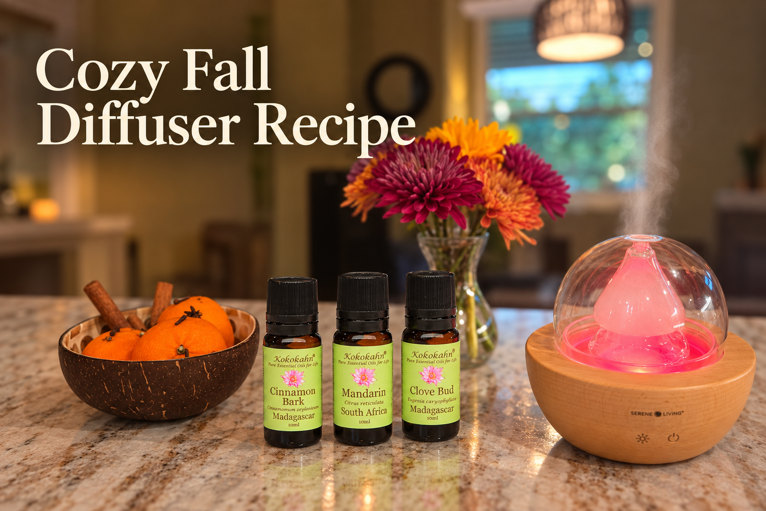 Kokokahn Cinnamon Bark, Mandarin, and Clove Bud essential oils beside a diffuser, mandarins, cinnamon sticks, and fall flowers.
